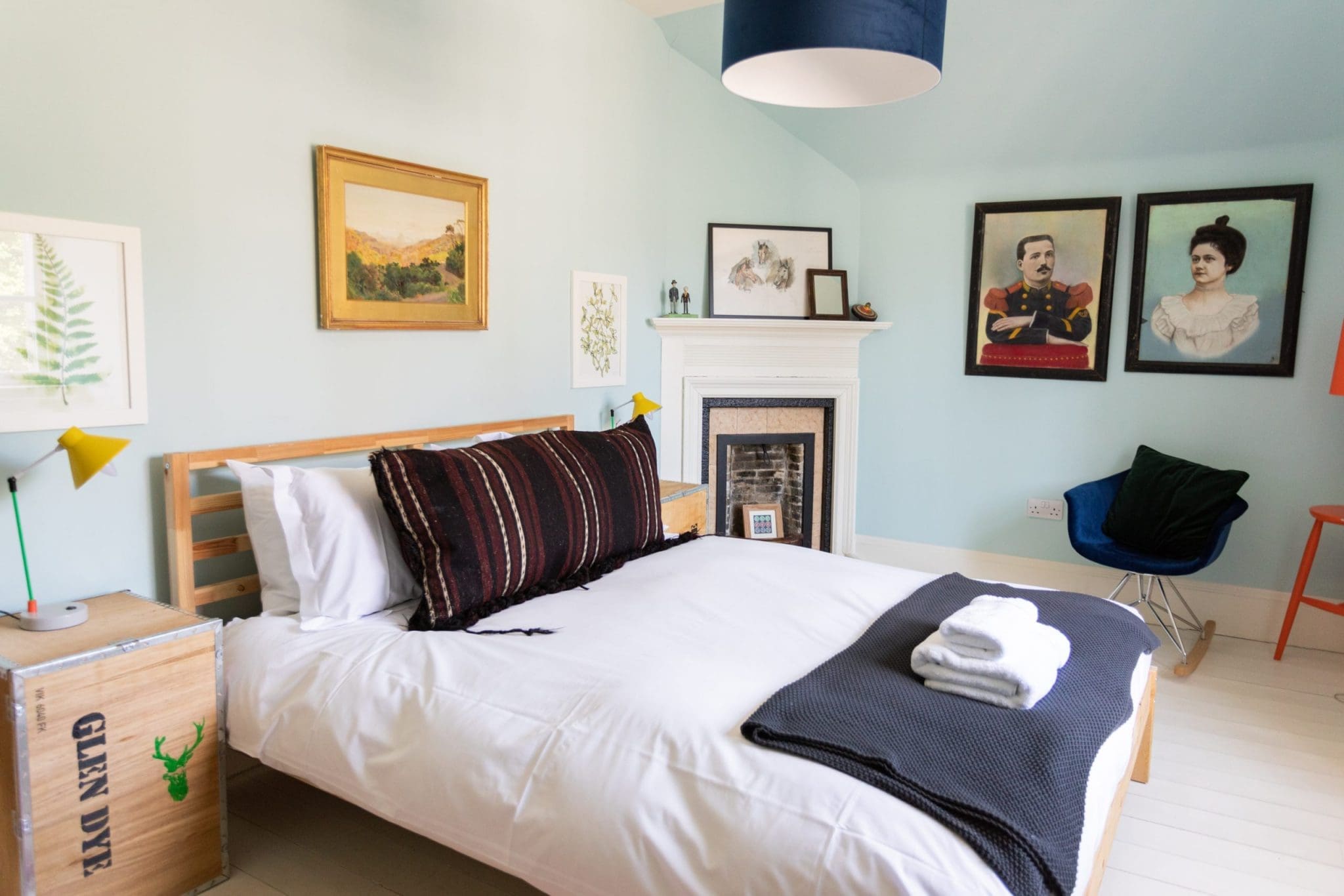 Photo taken of the bedroom interior of the North Lodge Cabin. Showcasing its bright colours, and cosy furnishings.