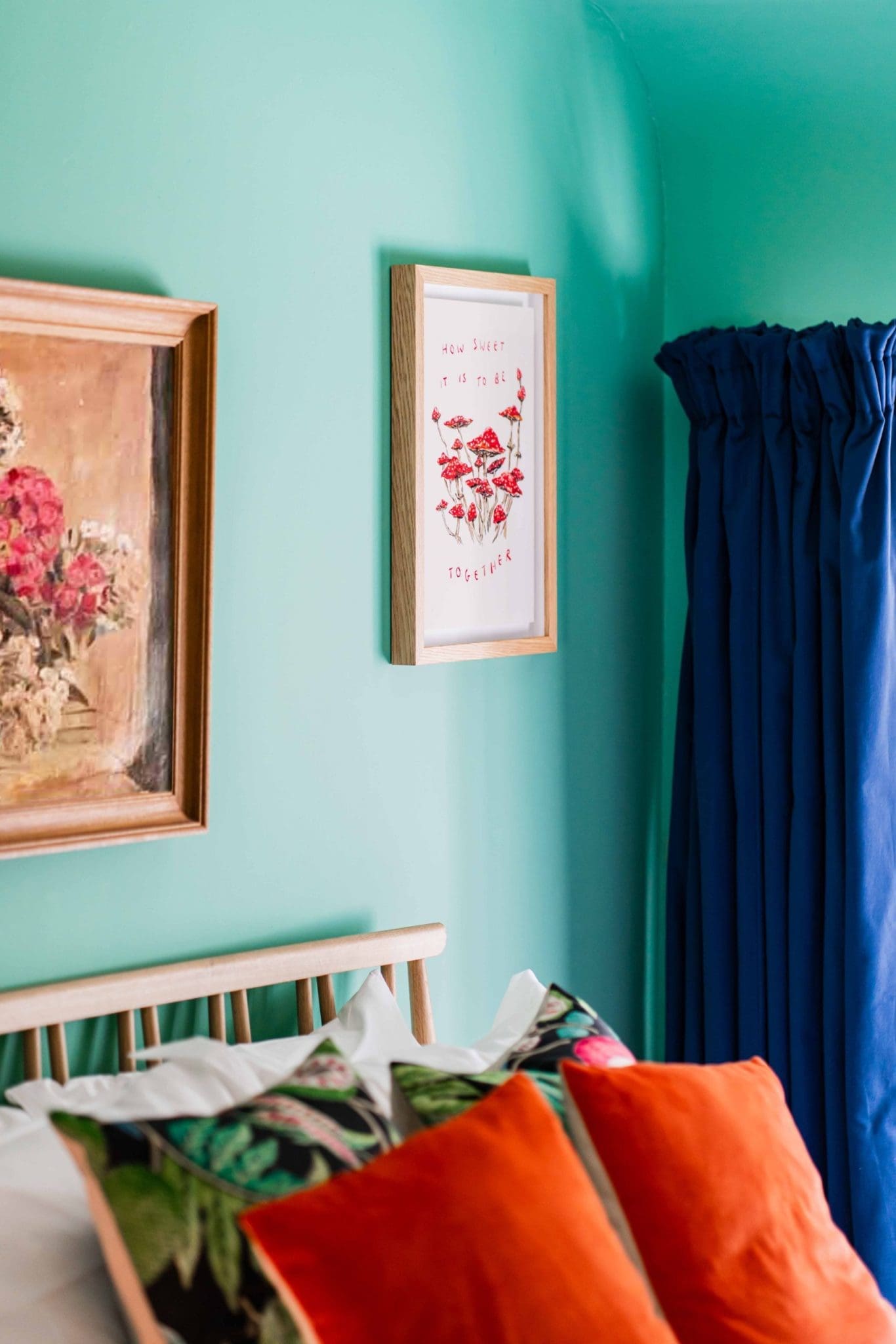 Luxury Double room at The Coach House with antique art on the walls plush orange cushions and blue curtains at Glen Dye Cabins and Cottages