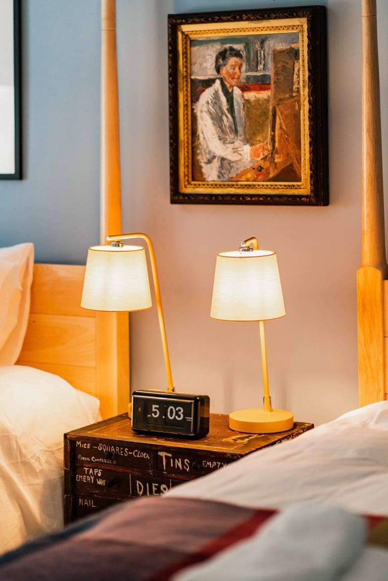 Luxury twin room with vintage bedside table alarm clock and two lamps and Glen Dye Cabins and Cottages