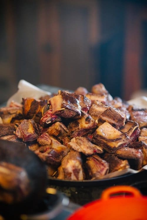 A bowl full of cooked chopped meat ready to be served at our seasonal feast event