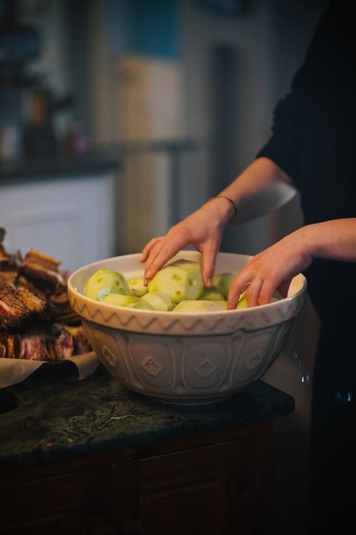 a bowl full of peeled apples