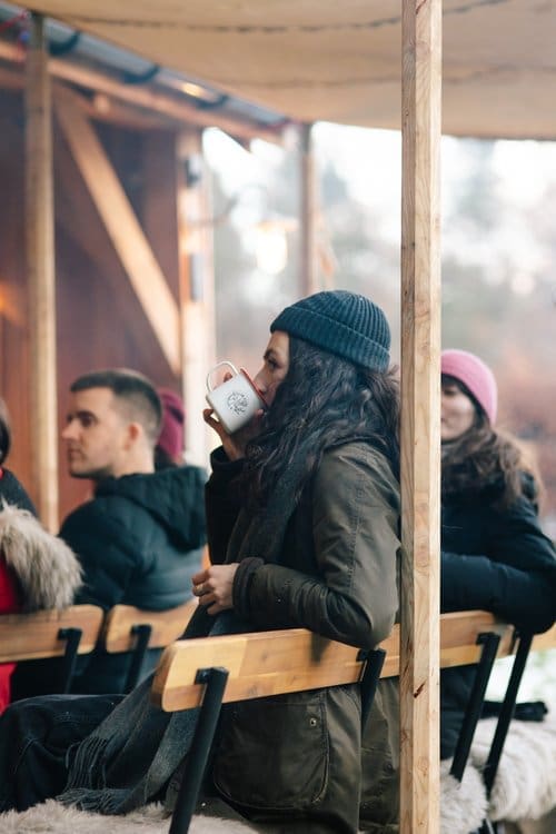 A guest enjoying a warm drink at one of our seasonal feast events