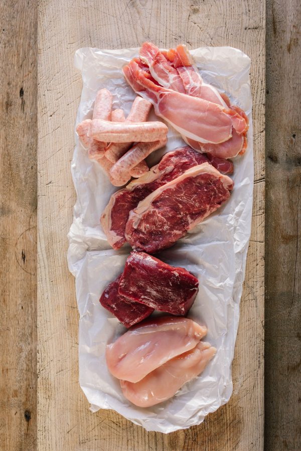 A selection of meat and sausages as part of a meat hamper.