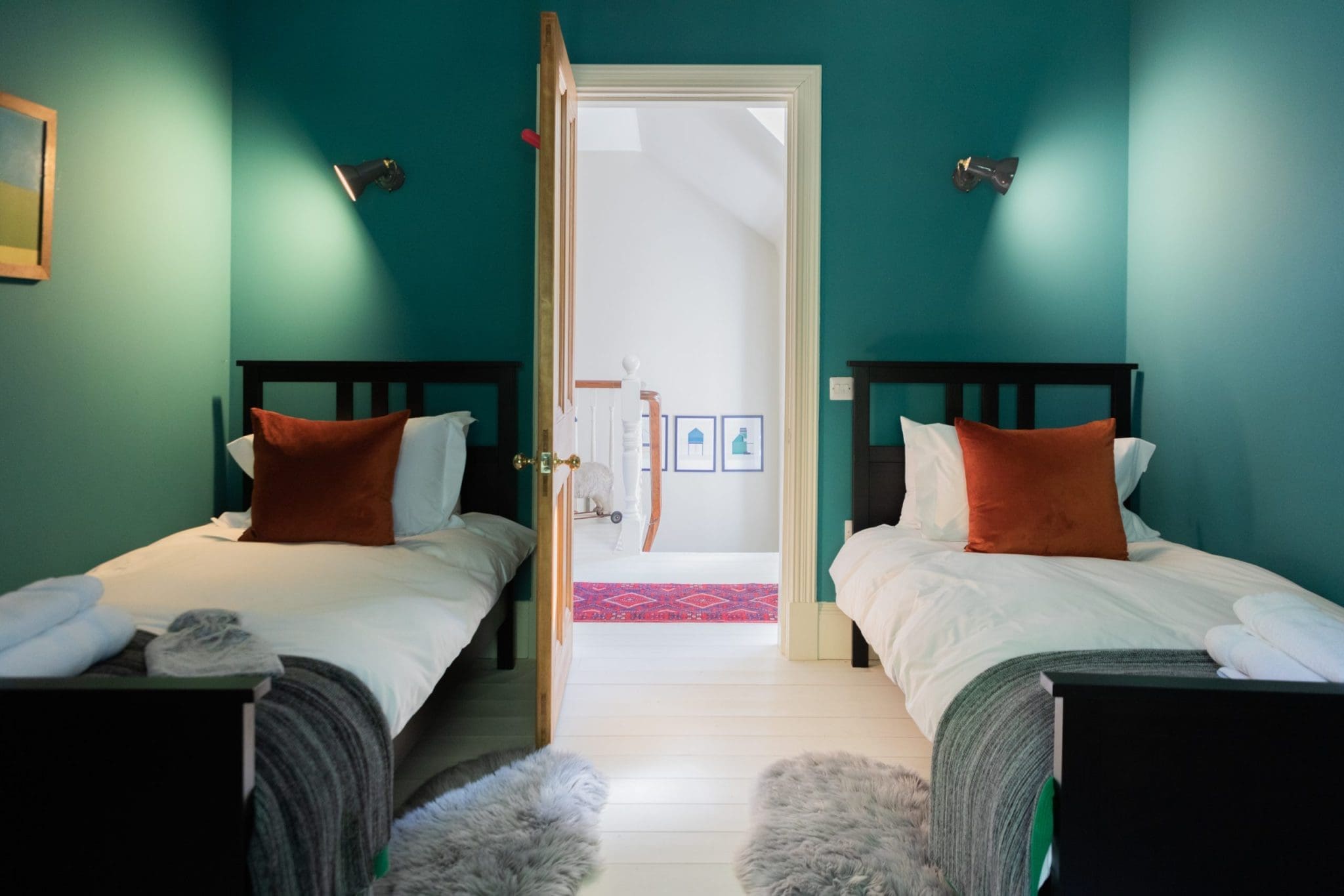 Photo taken of bedroom the interior of the North Lodge Cabin, Showcasing its bright colours and cosy finishings.