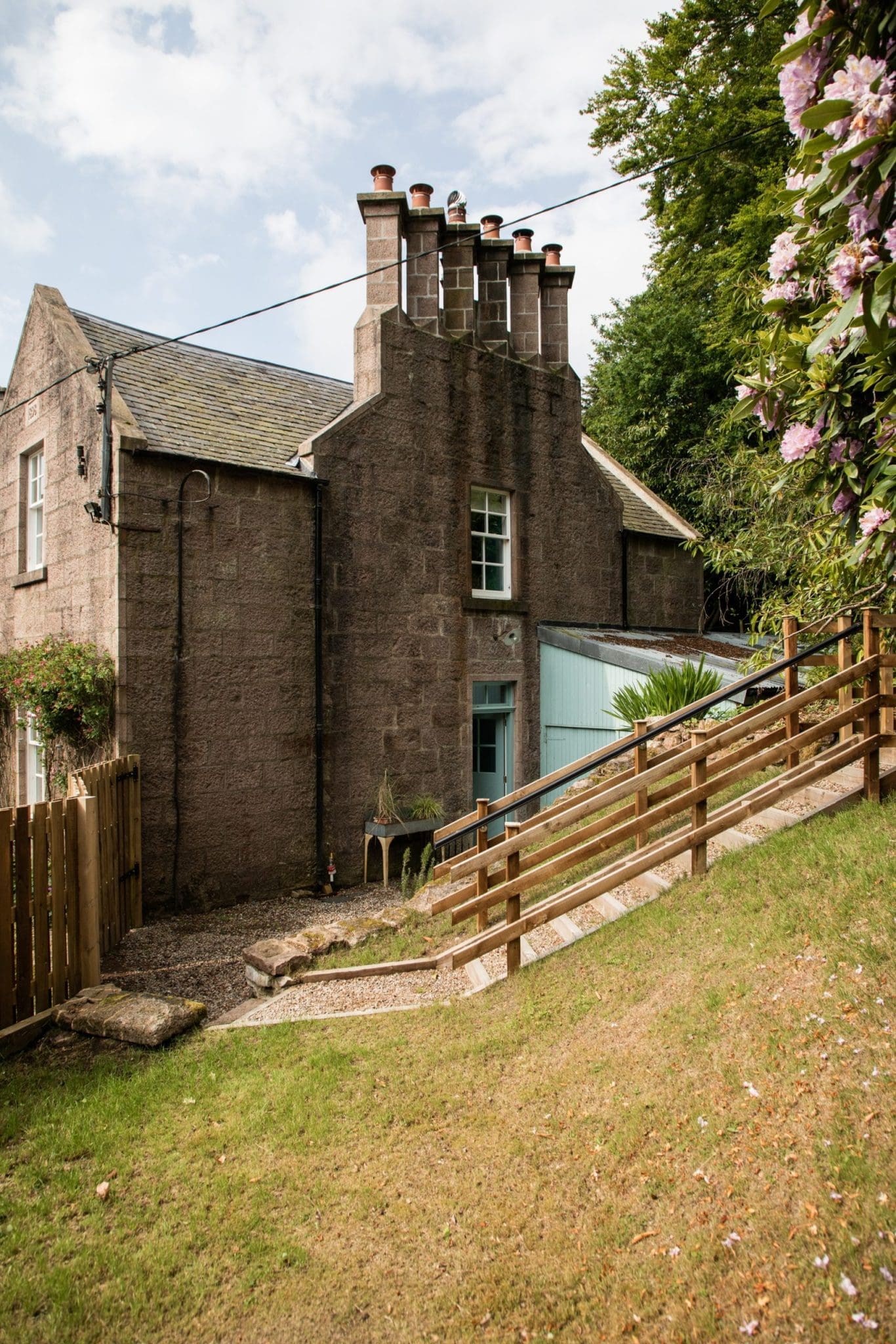 A photo taken of the side entrance to Cottage, compiled as part of the images from the North Lodge Cabin collection.