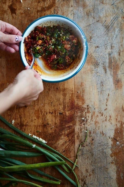 Top down view of a chilli marinate being made ready for cooking.