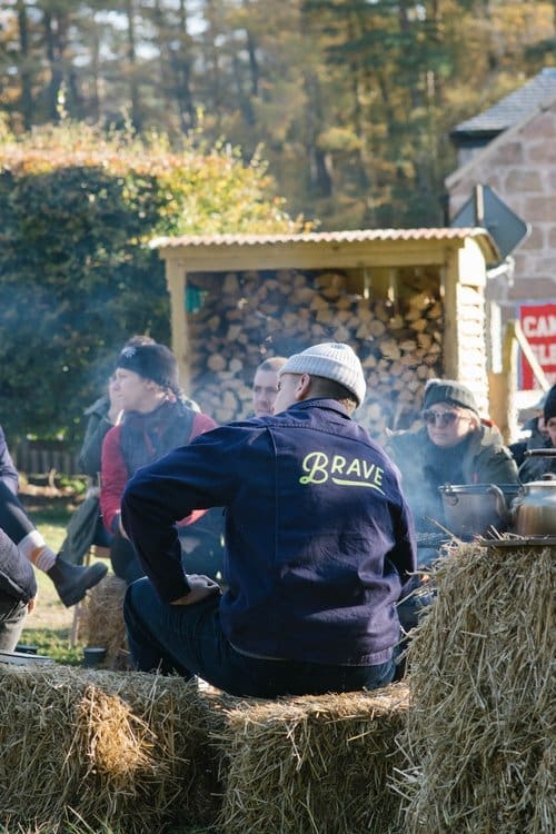 Photo taken at the Taigh music event. Guests sitting on hay bales.